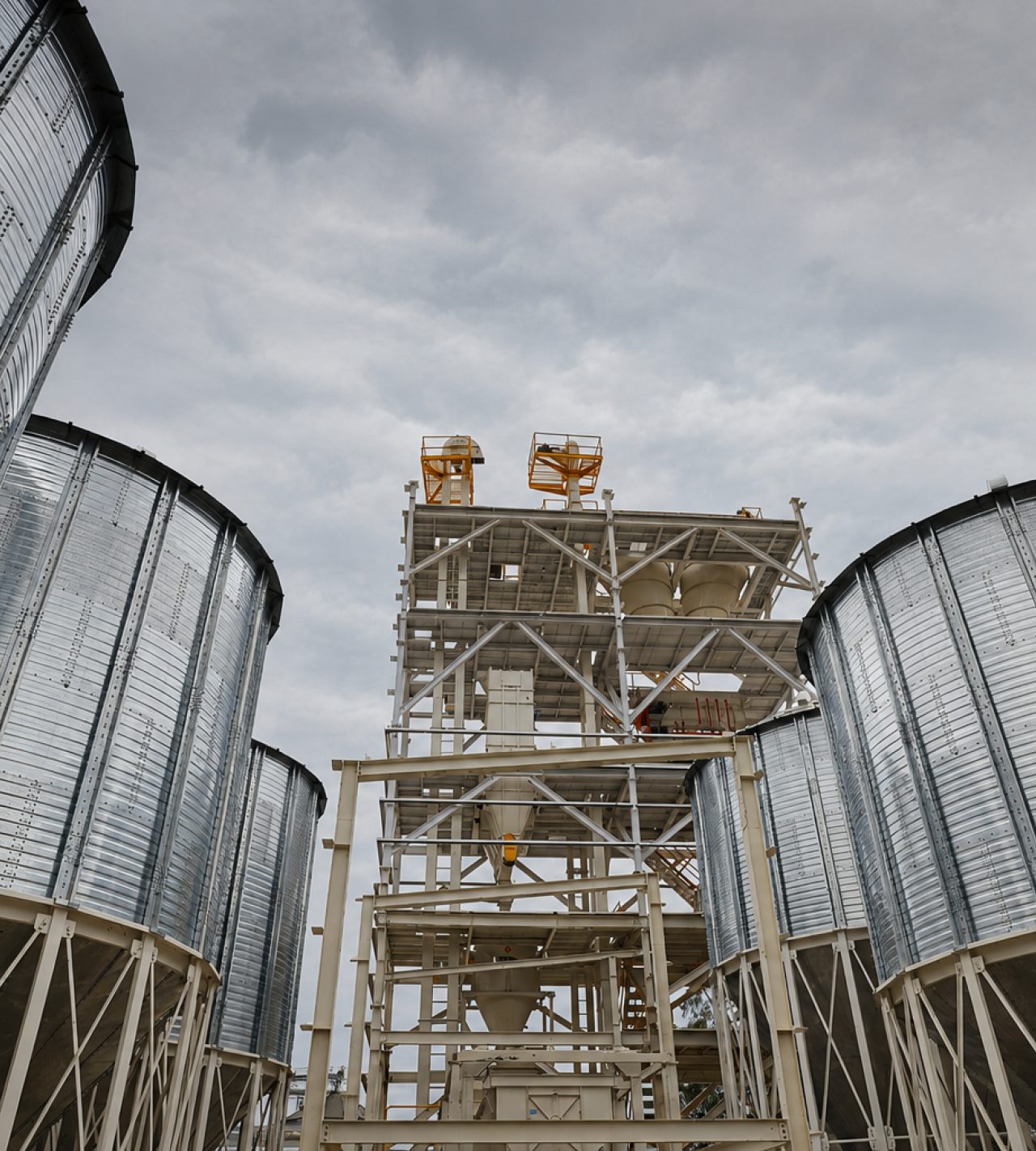 Steel silos and conveying tower at a raw material storage facility