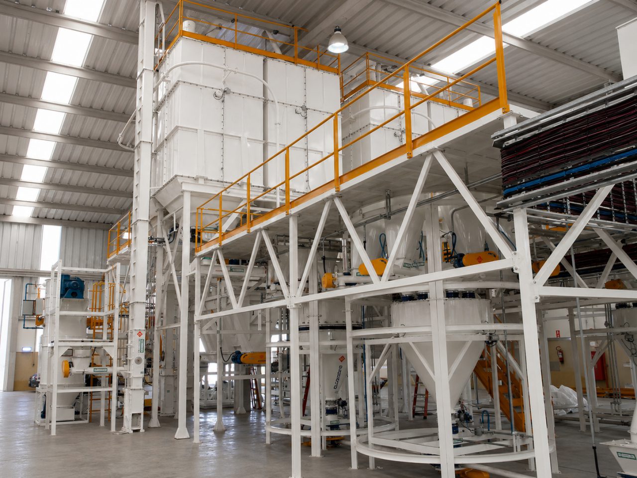 A vitamin concentrate plant, with storage hoppers and an operating platform